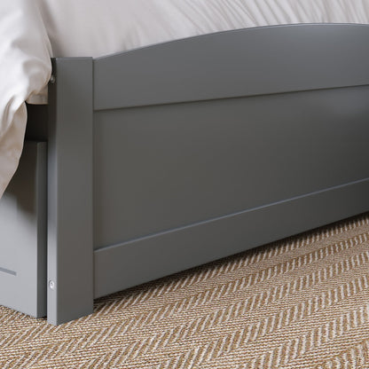 Gray bed frame on a carpeted floor