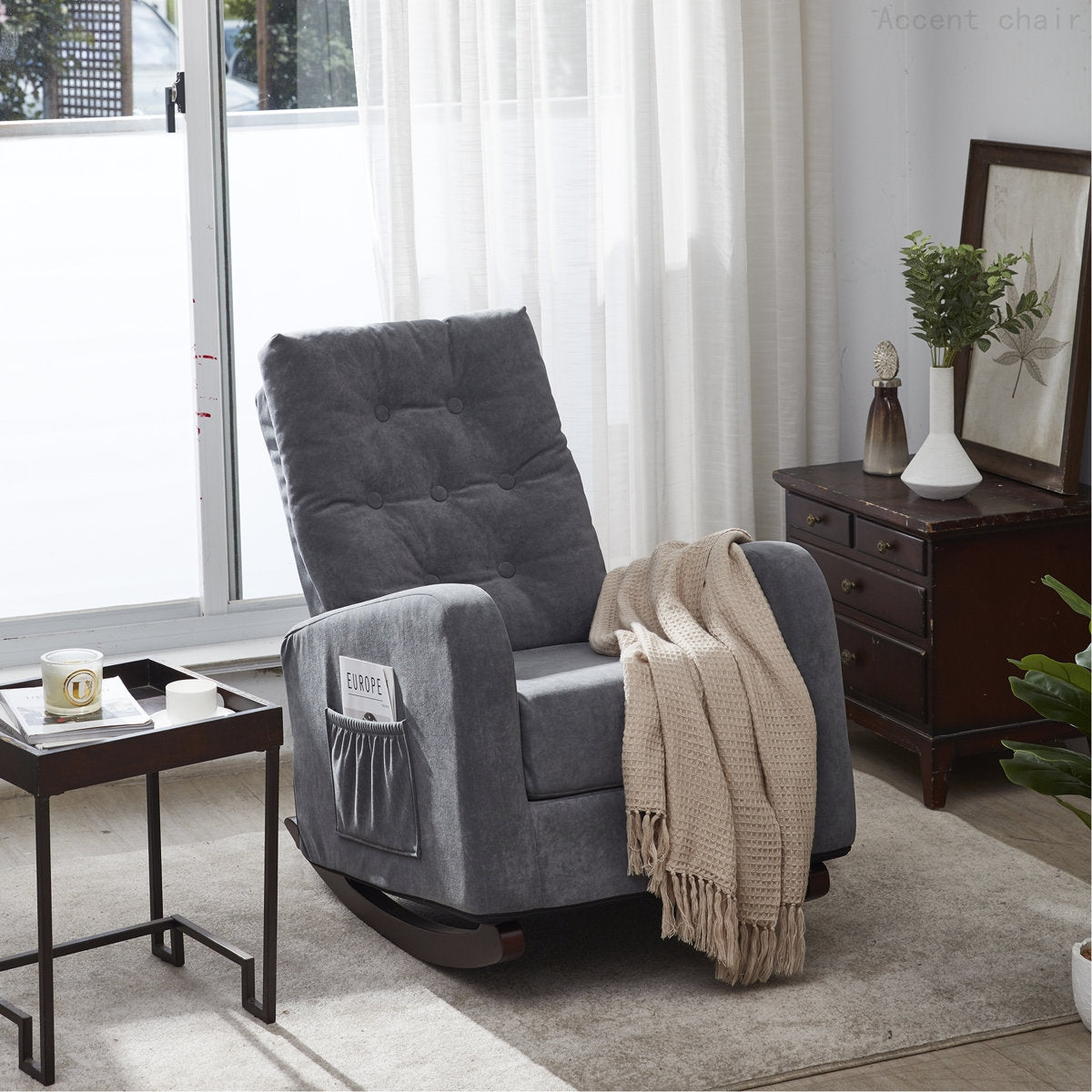 Gray recliner chair with a blanket in a living room setting