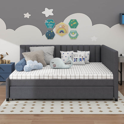 Gray sofa bed with cushions in a child-friendly room with decorative wall art.