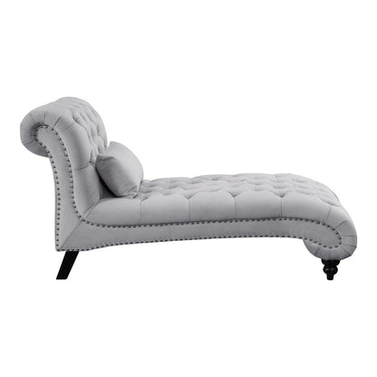 Gray tufted chaise lounge on a white background