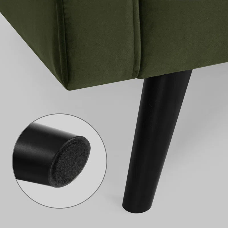 Green upholstered chair with a close-up of a black leg and felt pad on a light gray background.