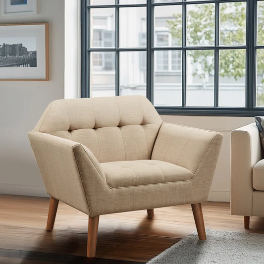Beige armchair in a room with large windows and a cityscape view.