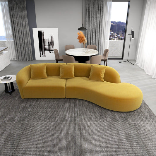 Modern living room with a yellow sofa, dining table, and chairs.