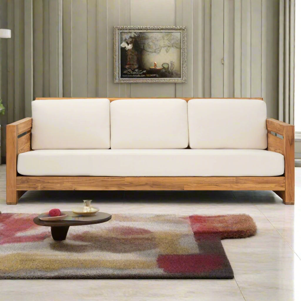 Wooden sofa with white cushions in a living room setting
