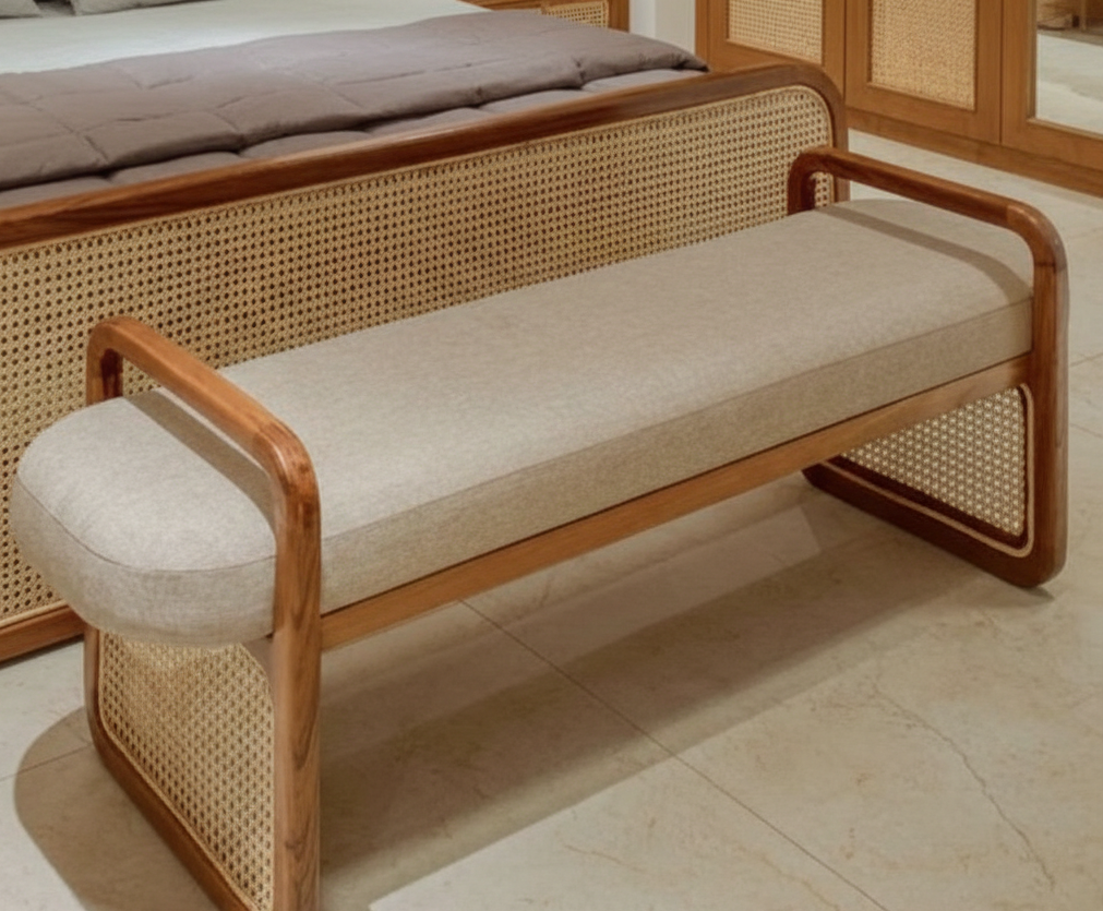 Beige bench with wooden frame and woven sides in a room setting.