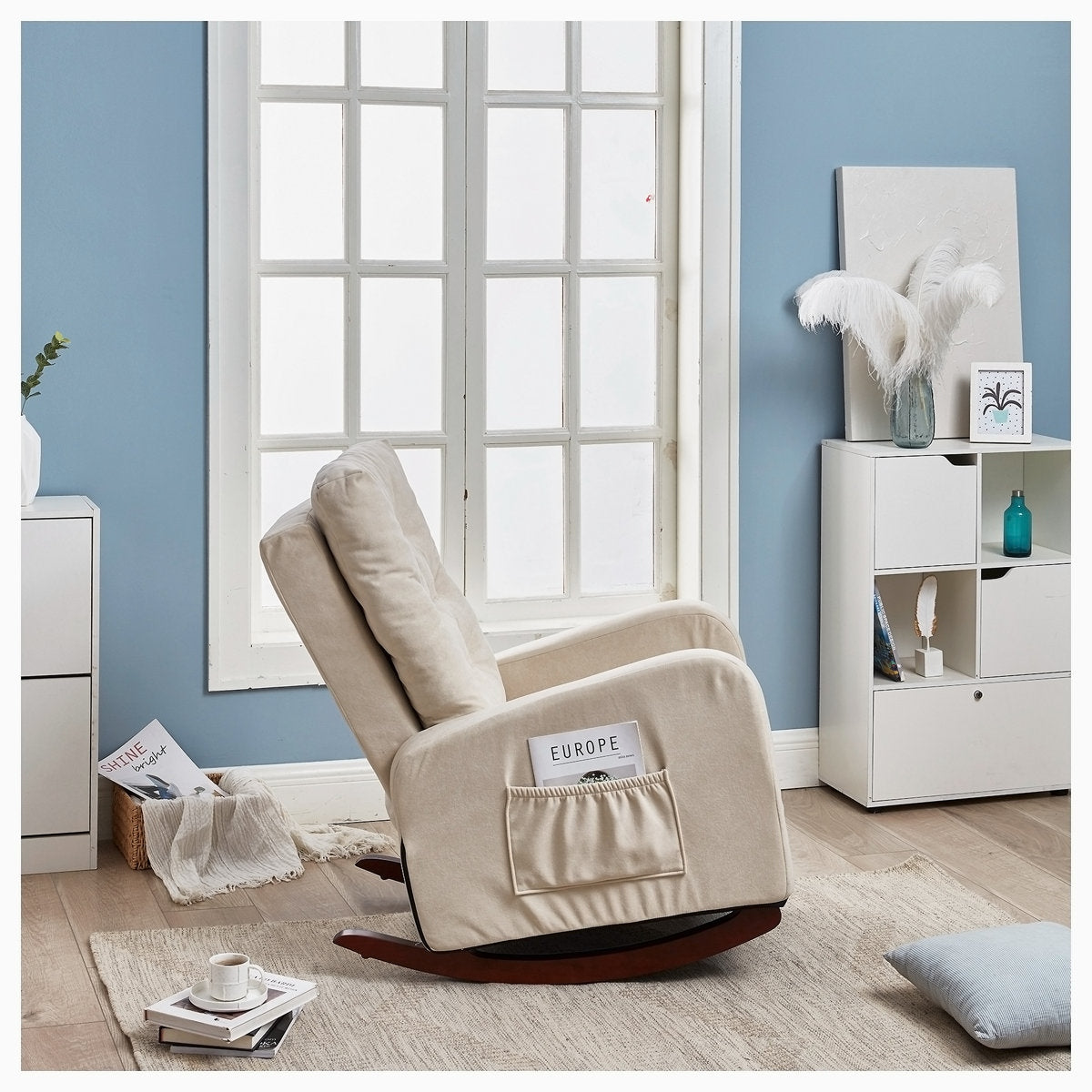 Beige recliner chair in a room with blue walls and white window frames.