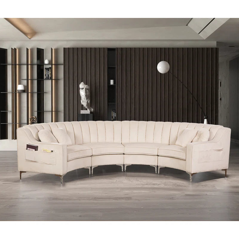 Beige sectional sofa in a modern living room setting with wooden flooring and dark walls.