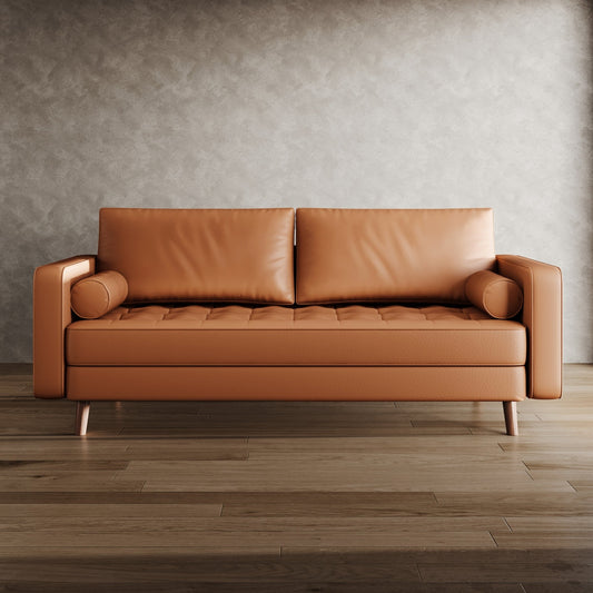 Brown leather sofa in a room with a textured wall and wooden floor.