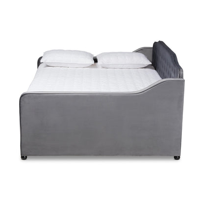 Gray upholstered bed with white bedding on a white background