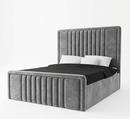 Gray upholstered bed with black bedding on a white background