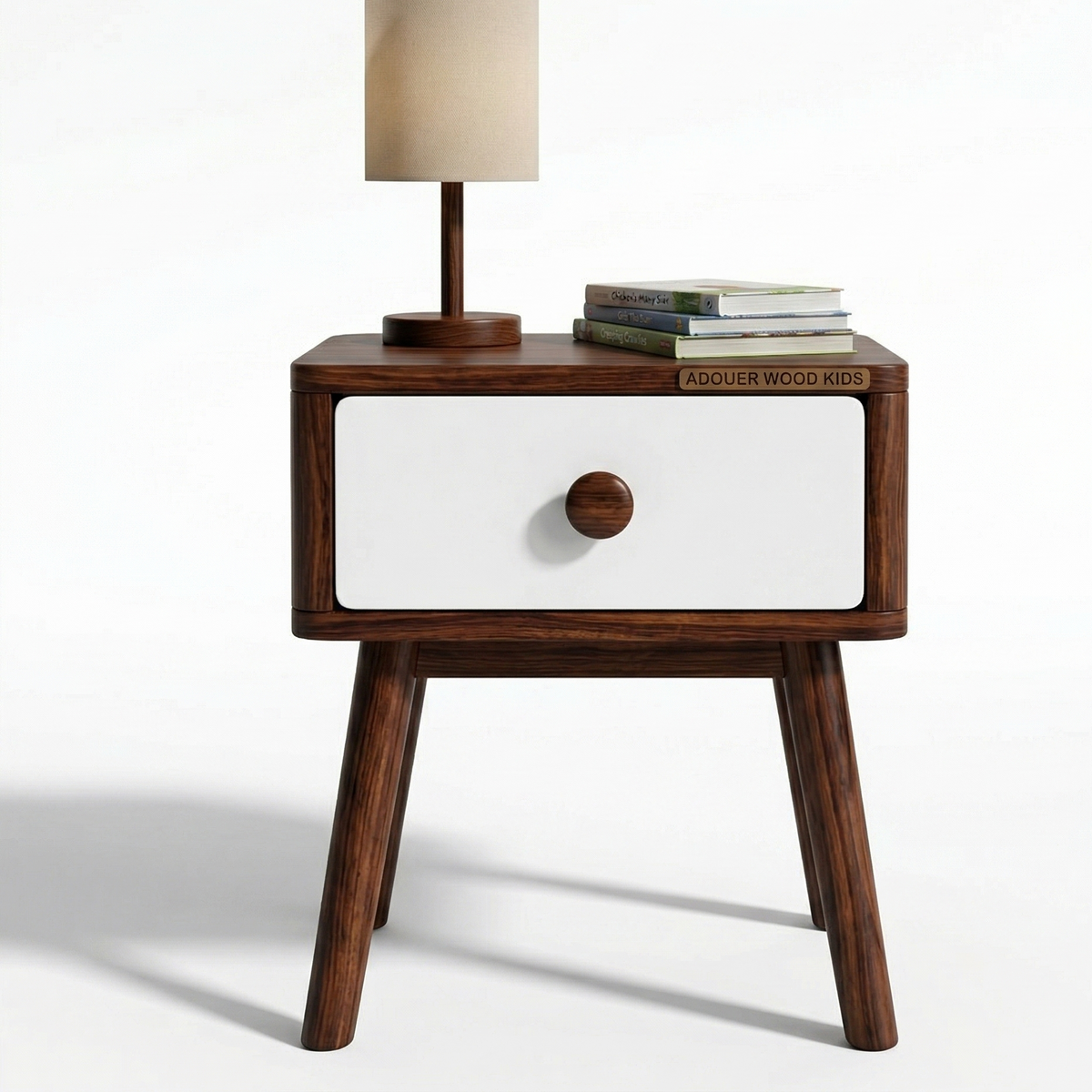 Wooden nightstand with a white drawer and a lamp on top against a white background