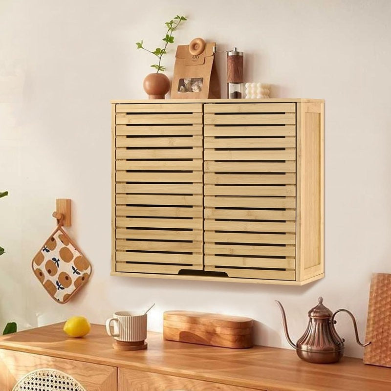 Wooden wall-mounted cabinet with decorative items on a light-colored wall.