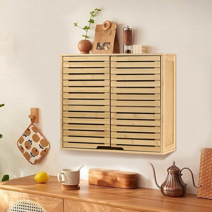 Wooden wall-mounted cabinet with decorative items on a light-colored wall.