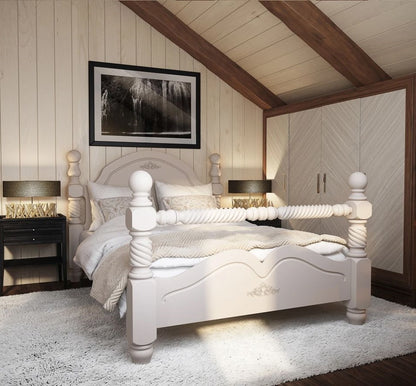Neatly made bed in a bedroom with wooden beams and framed picture on the wall.