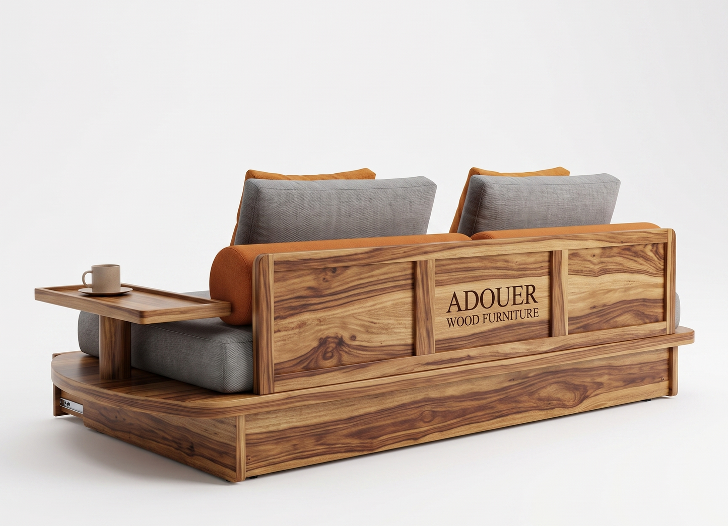 A modern wooden sofa with gray cushions and orange-brown accent pillows, featuring a side table on the left and the brand name 'ADOUER WOOD FURNITURE' engraved on the wooden backrest, set against a plain white studio background.