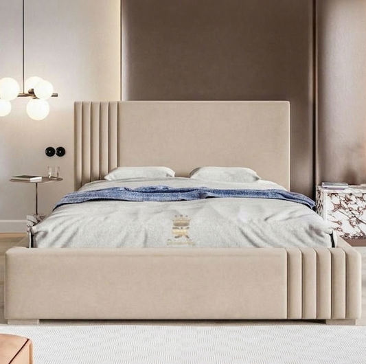 Beige upholstered bed in a modern bedroom setting with neutral walls and decor.