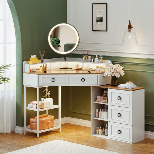 Makeup vanity with round mirror, drawers, and shelves against a green wall.