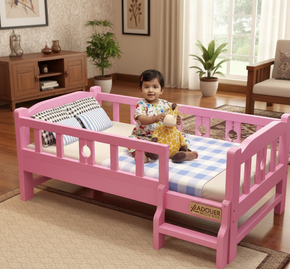 Child sitting on a pink bed in a room with furniture and plants