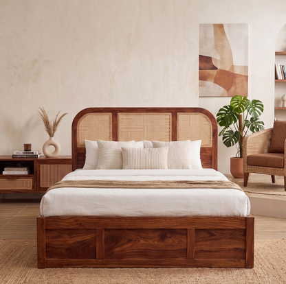Wooden bed with wicker headboard in a bedroom setting