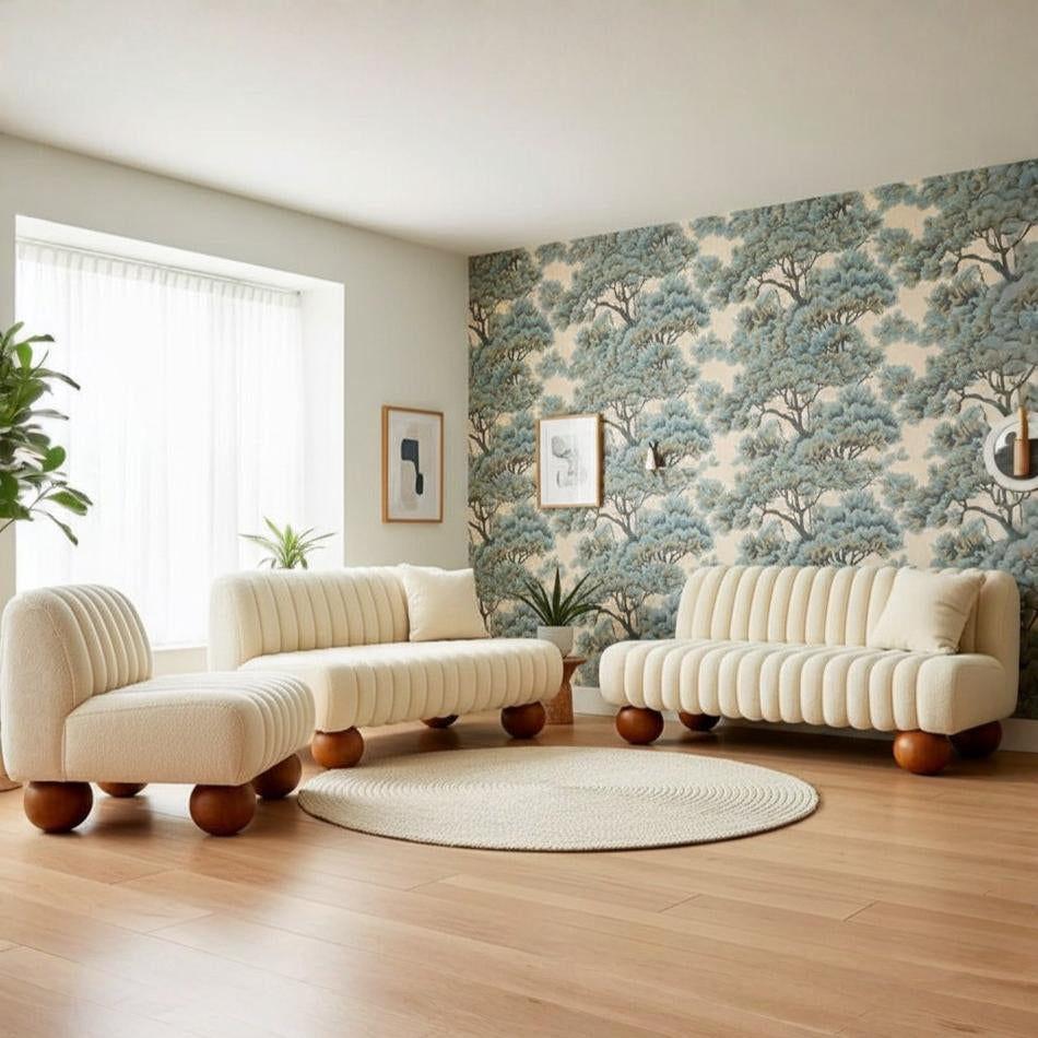 Modern living room with beige sofa set and tree-patterned wallpaper