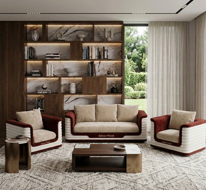 Modern living room with a sofa, armchairs, and a bookshelf.