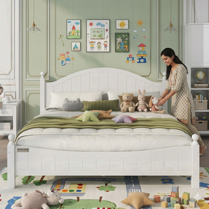 Woman arranging toys on a bed in a child's bedroom with colorful decor.