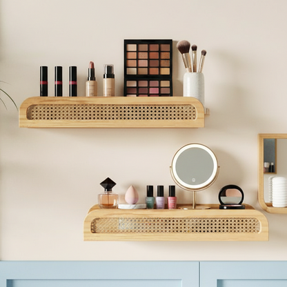 Makeup vanity setup with wooden shelves, mirror, and various cosmetic items on a light beige wall.