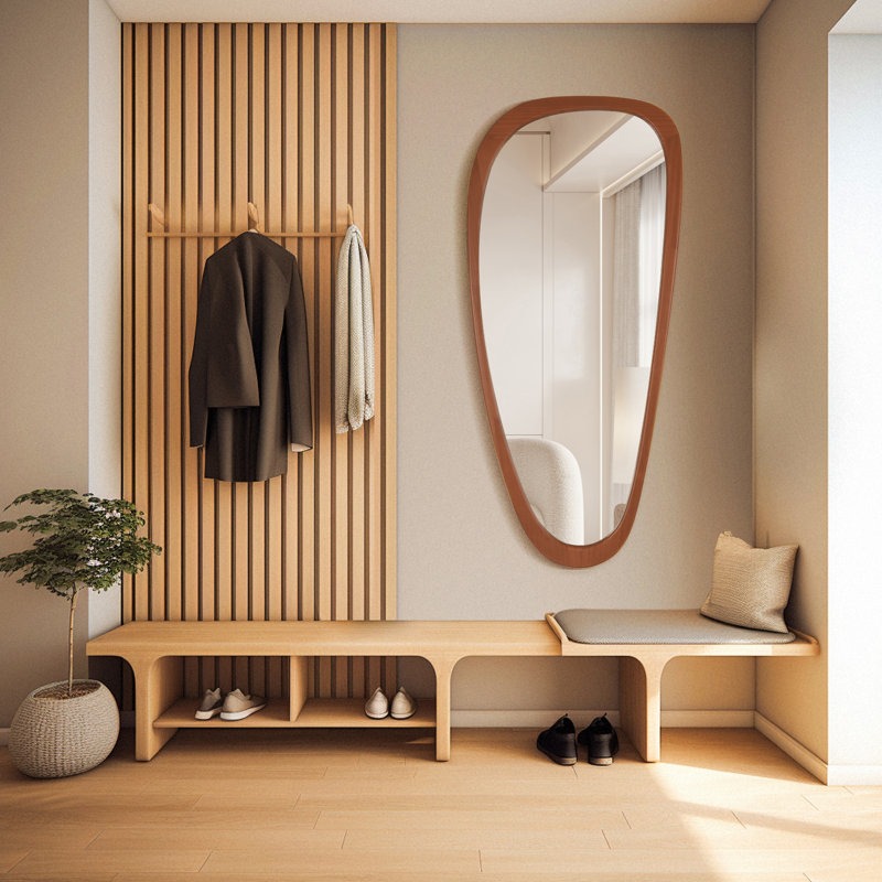 Modern interior design of a hallway with wooden bench, mirror, and coat rack.