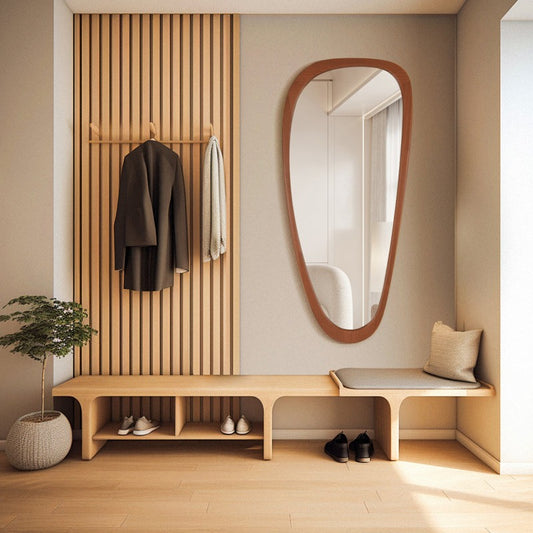 Modern interior design of a hallway with wooden bench, mirror, and coat rack.