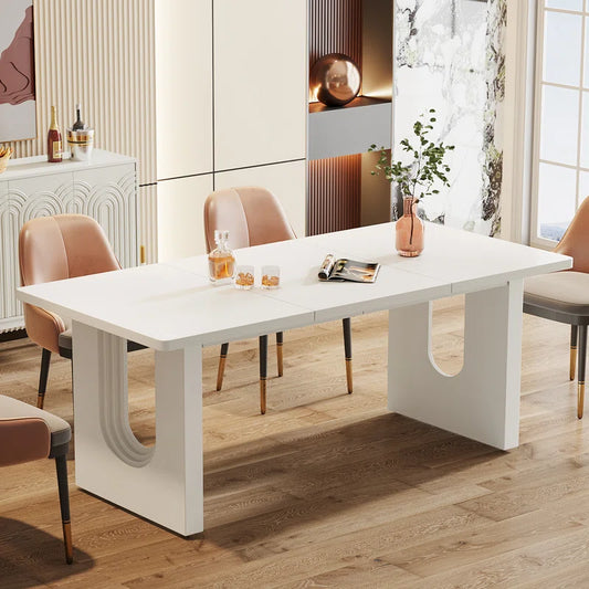 Modern solid sheesham wood dining table with a black and white finish and an arch base design, accompanied by four chairs with a matching design in a bright room.