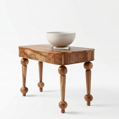Wooden side table with a bowl on a white background