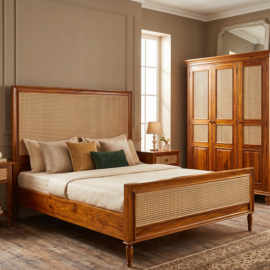 Wooden bed with wicker headboard and footboard in a bedroom setting.