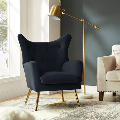 Navy armchair with gold legs in a modern living room setting