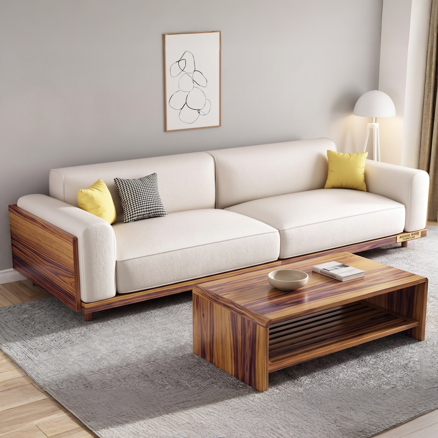 A modern three-seater sofa with cream upholstery and rich brown wood grain sides, styled in a living room setting with two accent pillows, a matching wooden coffee table, a gray rug, and a wall-mounted framed art piece.