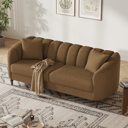 Brown sectional sofa in a living room with a rug and small table.