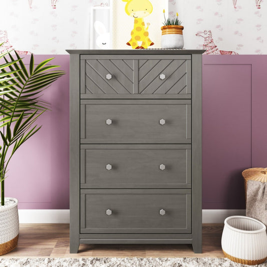Gray dresser with four drawers in a room with purple walls and decorative items.