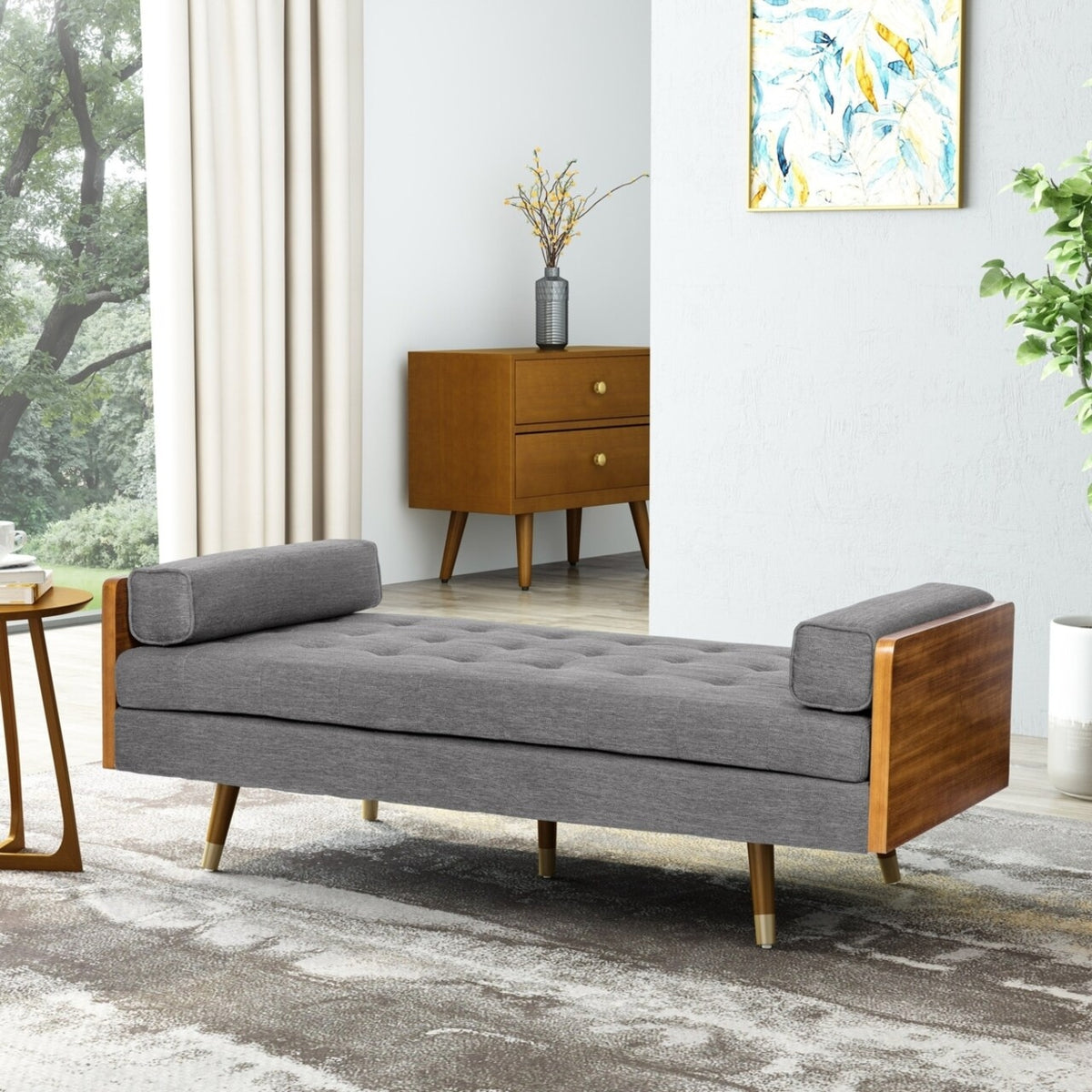 Gray upholstered bench with wooden frame in a living room setting