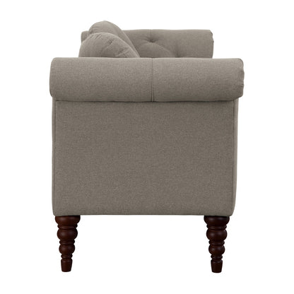 Gray armchair with wooden legs on a white background