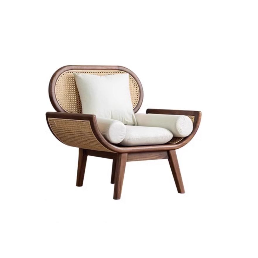 Wooden armchair with wicker backrest and white cushions on a white background