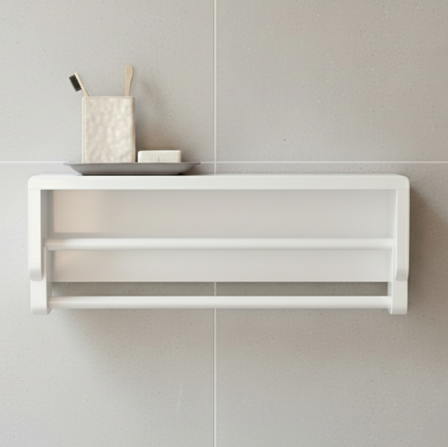 White wall-mounted shelf with decorative items against a tiled wall.