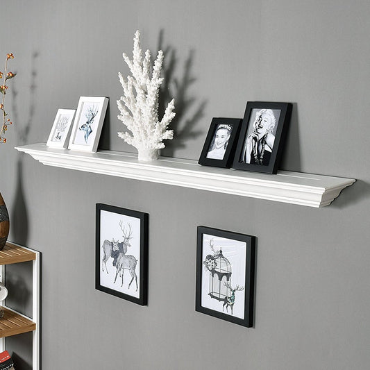 White wall shelf with decorative items against a gray wall