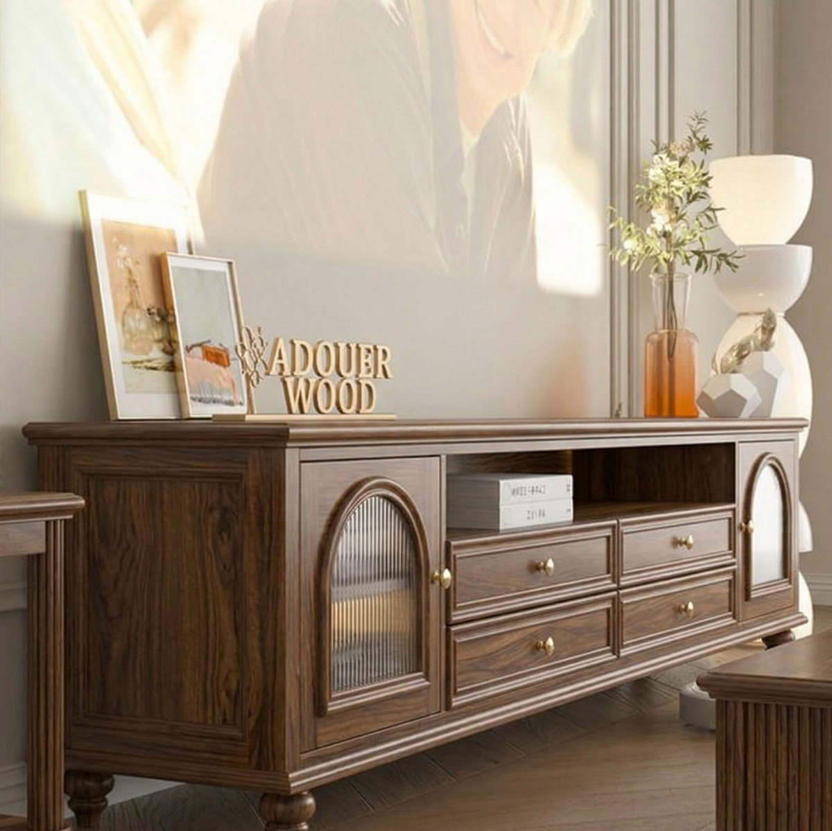 Wooden TV stand with decorative items in a living room setting