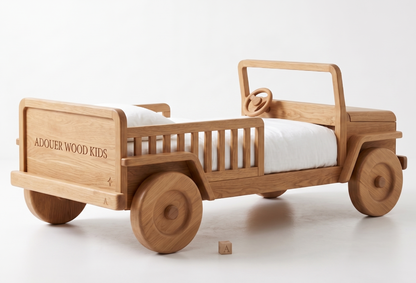 Wooden toy car bed with white mattress on a white background