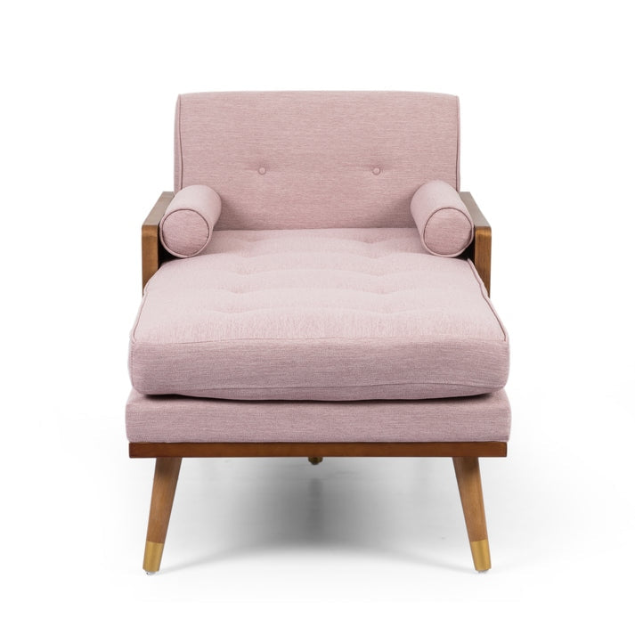 Pink armchair with wooden legs on a white background