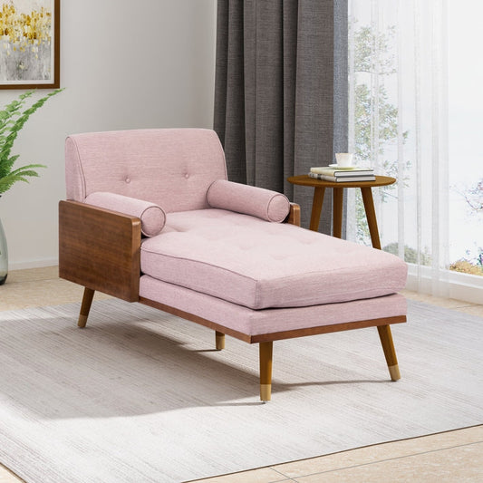 Pink chaise lounge with wooden frame in a living room setting