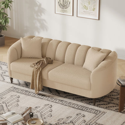 Beige sofa in a living room with a patterned rug and decor elements.