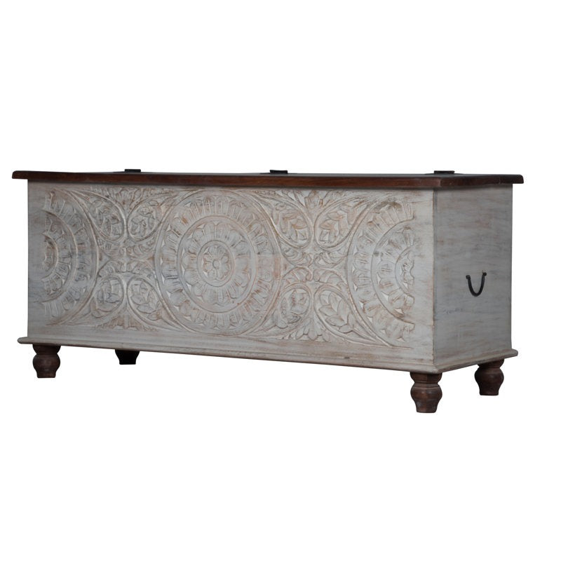 Decorative wooden chest with intricate carvings on a white background