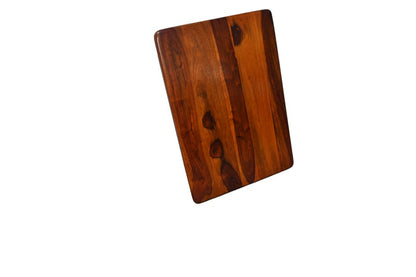 Wooden cutting board on a white background