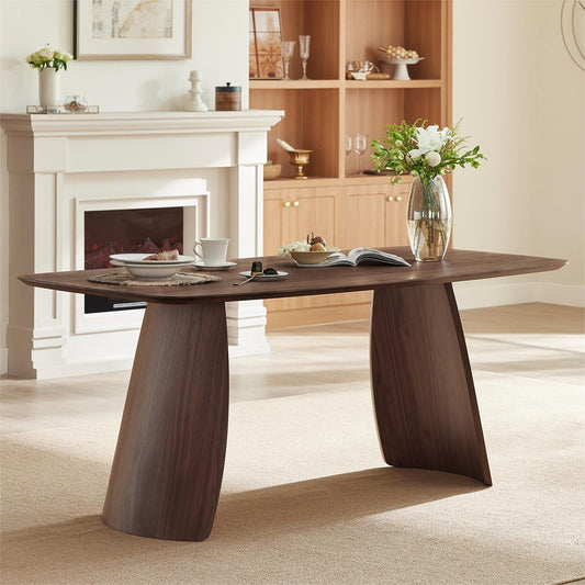 Wooden dining table in a living room with a fireplace and bookshelf.