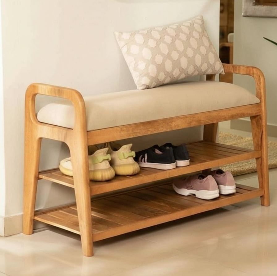 Wooden shoe bench with cushioned seat and shoe storage shelves, shoes on display.